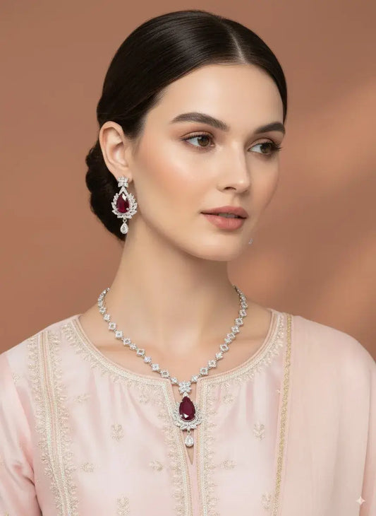 Red Stone CZ Necklace Set with Earrings worn by a model, featuring a bold teardrop red gemstone and matching earrings.