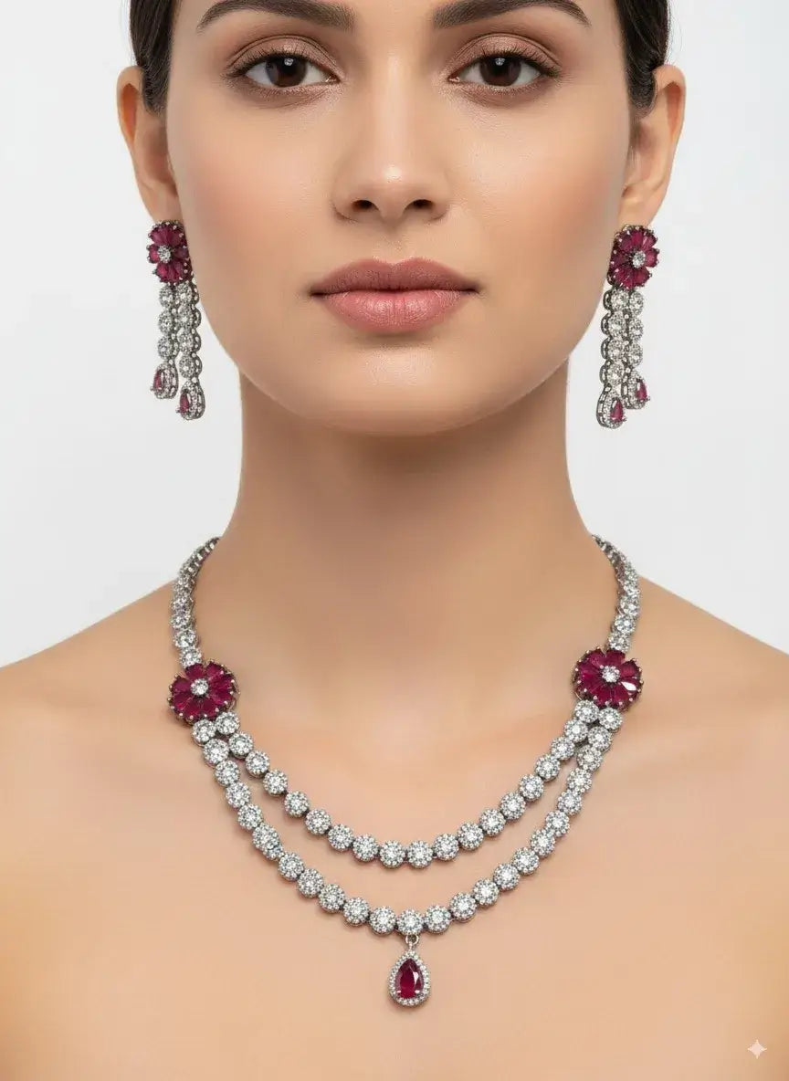 red stone silver cz necklace set with earrings worn by model, featuring red stone accents and cz diamonds.
