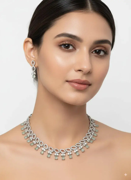 Pastel Green Silver CZ Necklace Set with Earrings worn by model featuring delicate pastel green stones and sparkling CZ diamonds.