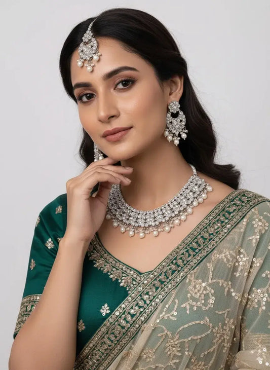 Bridal CZ Diamond Choker Necklace Set with Pearls & Maang Tikka worn by model, showcasing elegance with matching jewelry.