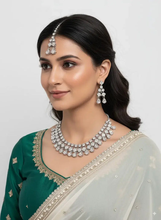 Bridal Diamond Look CZ Necklace Set with Earrings & Maang Tikka worn by a model, showcasing its elegance in a layered choker design.