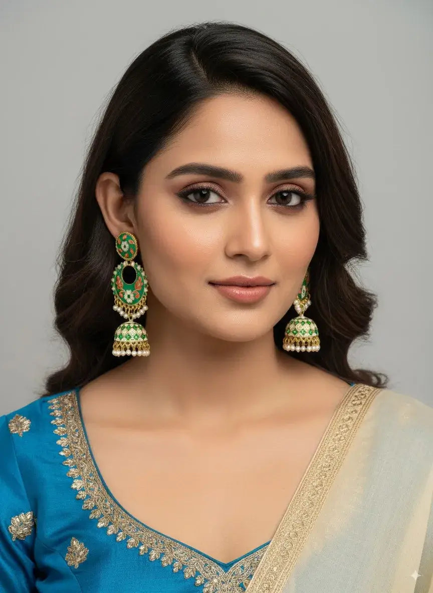 Gehna Green Enamel Jhumka Earrings with Pearl Drops – Designer Traditional Jewellery for Women worn by a model.