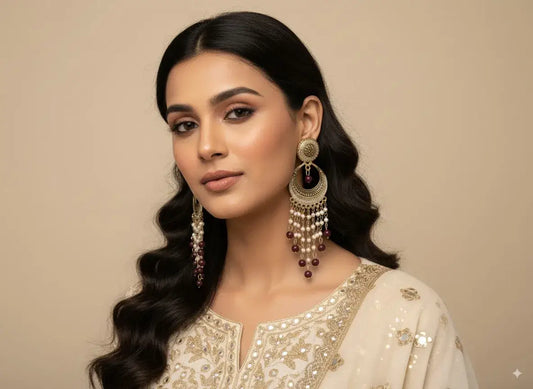 Antique Gold Long Chandelier Earrings with Pearls & Maroon Beads – Bridal & Festive Jewellery worn by a model.