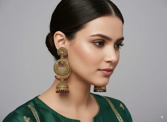 Gehna Antique Gold Plated Jhumka Earrings for Women – Traditional Ethnic Jewellery worn by a model in green attire.