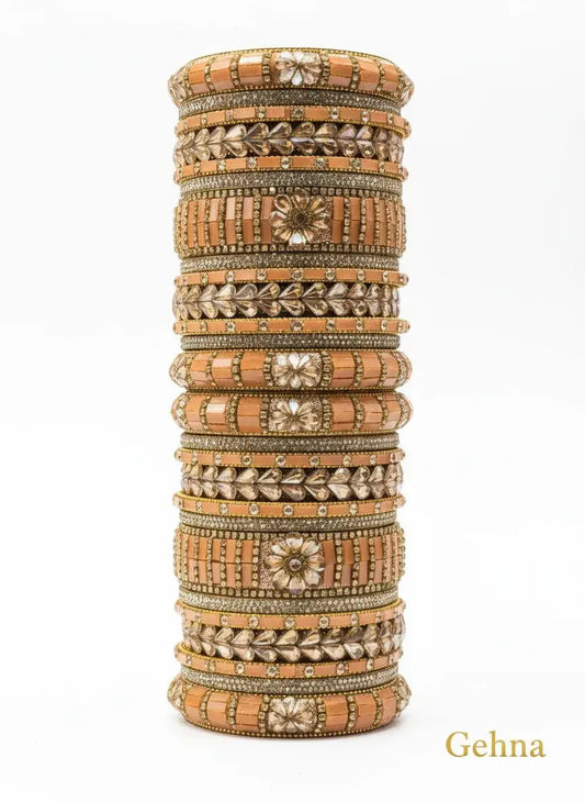 Peach-Gold Bridal Bangle Set – 26 Pieces Kundan & Stone Work by Gehna displayed elegantly on a white background.