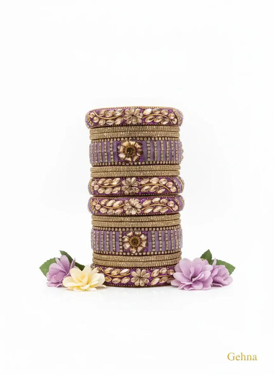 Lavender Bridal Kundan Floral Bangles Set – Gehna featuring floral motifs and golden accents.